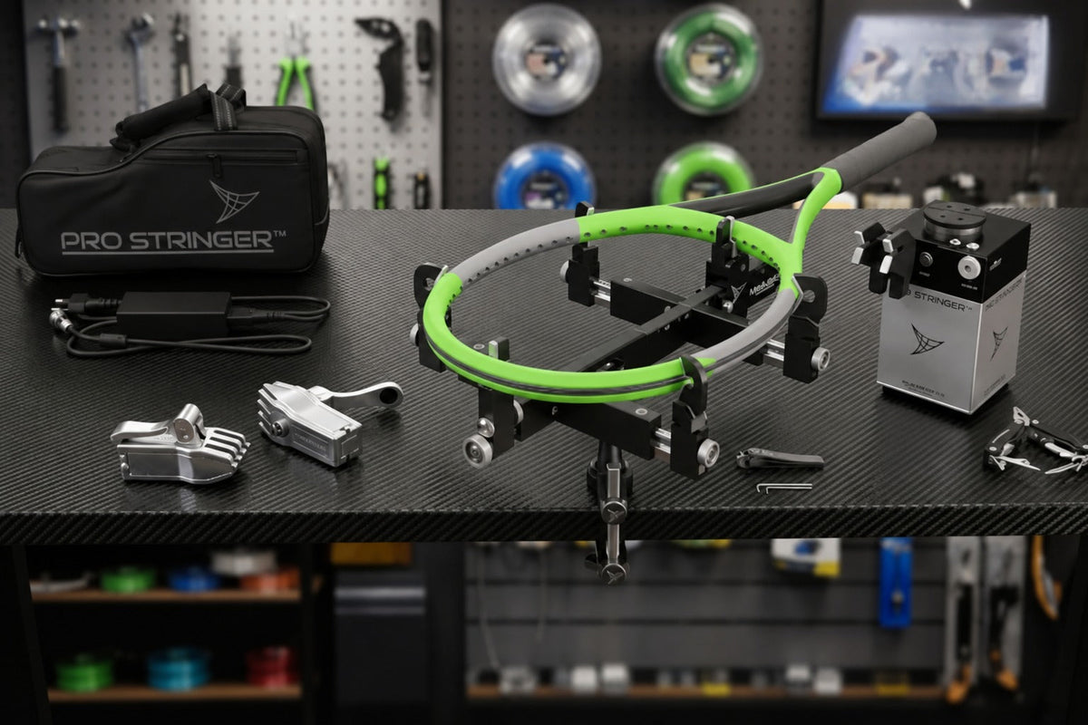 Pro Stringer portable tennis racquet stringing machine hardware setup on a workshop table with tools.
