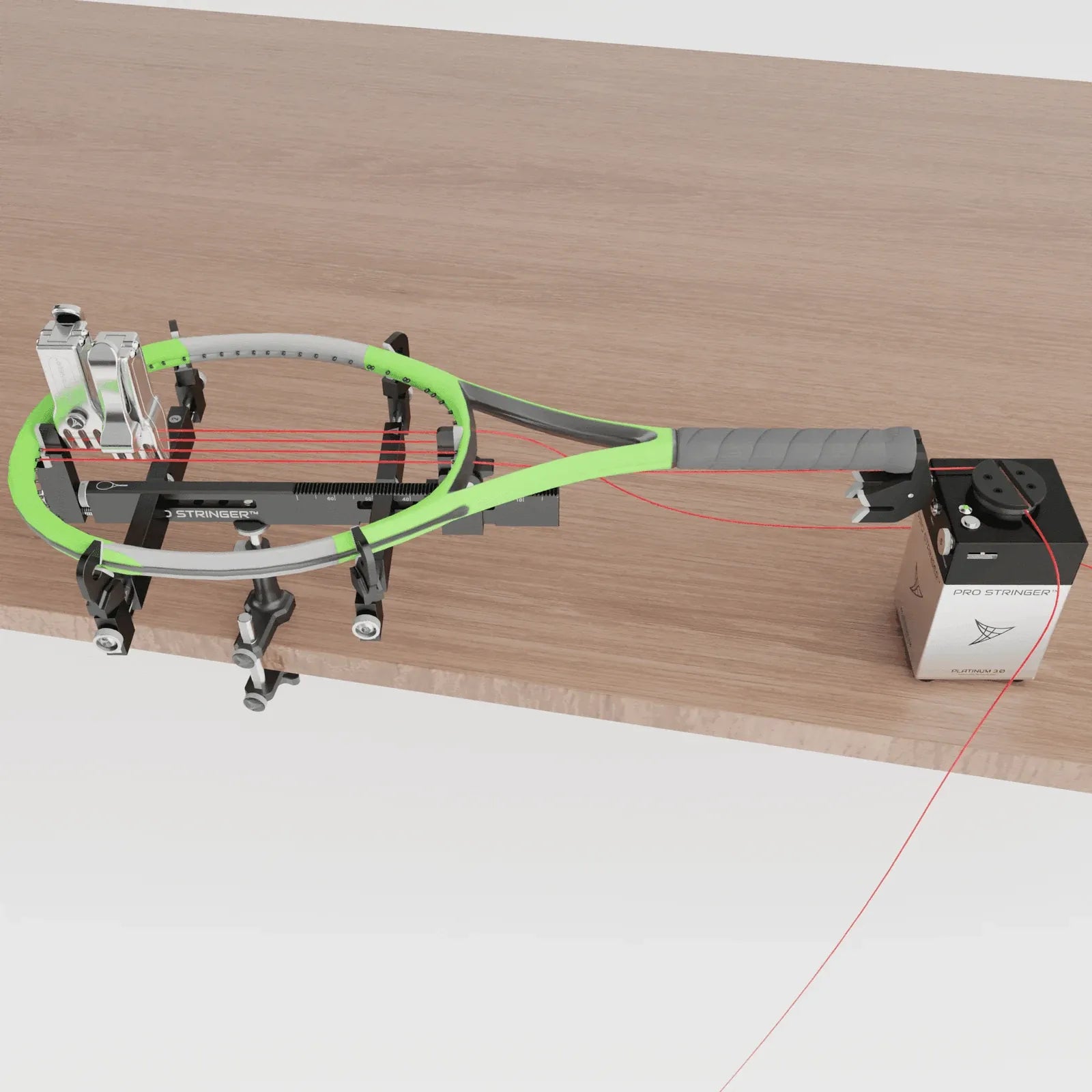 Pro Stringer stringing a racquet clamped to the edge of a table
