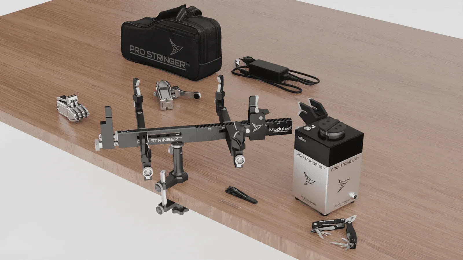 Pro Stringer Platinum 3.0 kit laid out on a table with travel bag, ModuleX and clamps